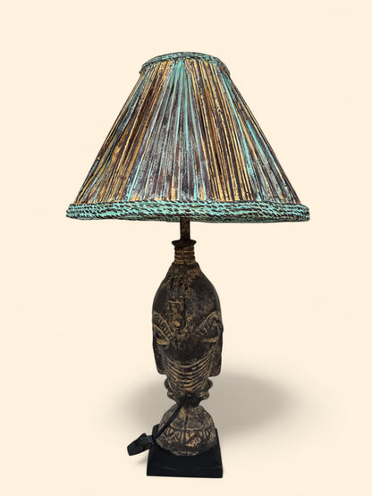 Decorative table lamp with a textured shade on a beige background
